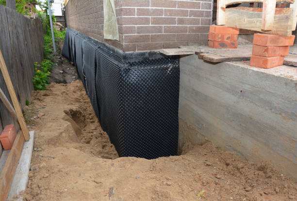 Happy homeowners after waterproofing job in Jessup